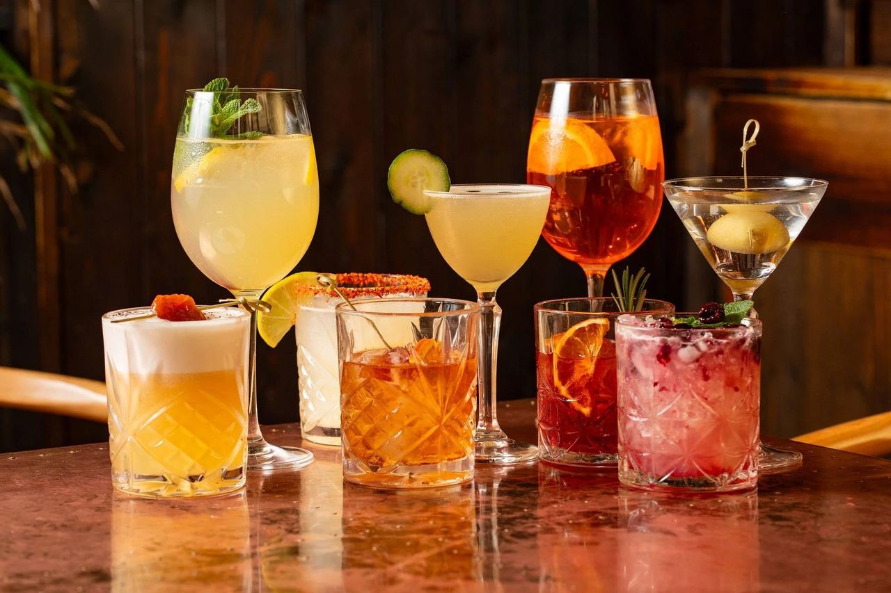 A row of cocktails on the bar at Lost in the Lanes