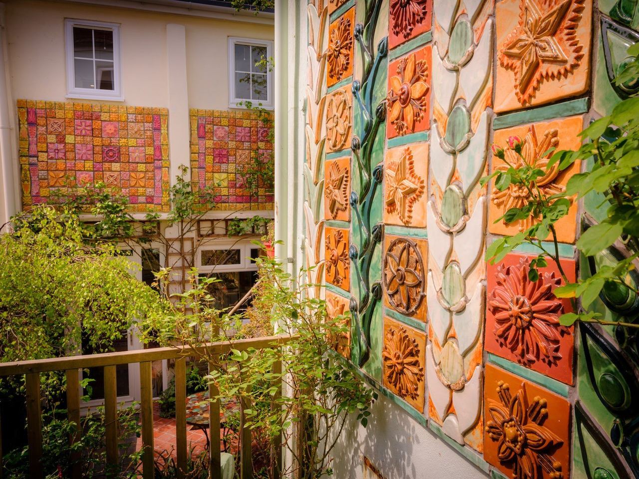 A garden wall of hand-made ceramic tiles at The Ceramic House