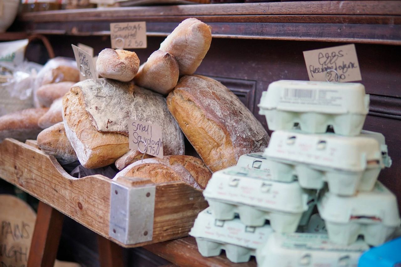 Loaves and boxes of eggs on the wooden counter at Marmalade