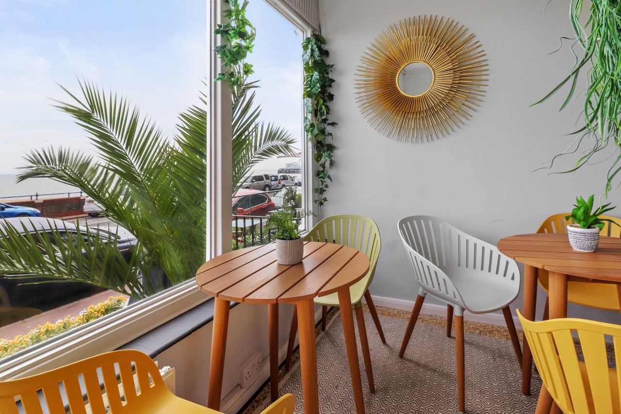 The sunny breakfast room at Beach Front Guest House, looking out to the seafront